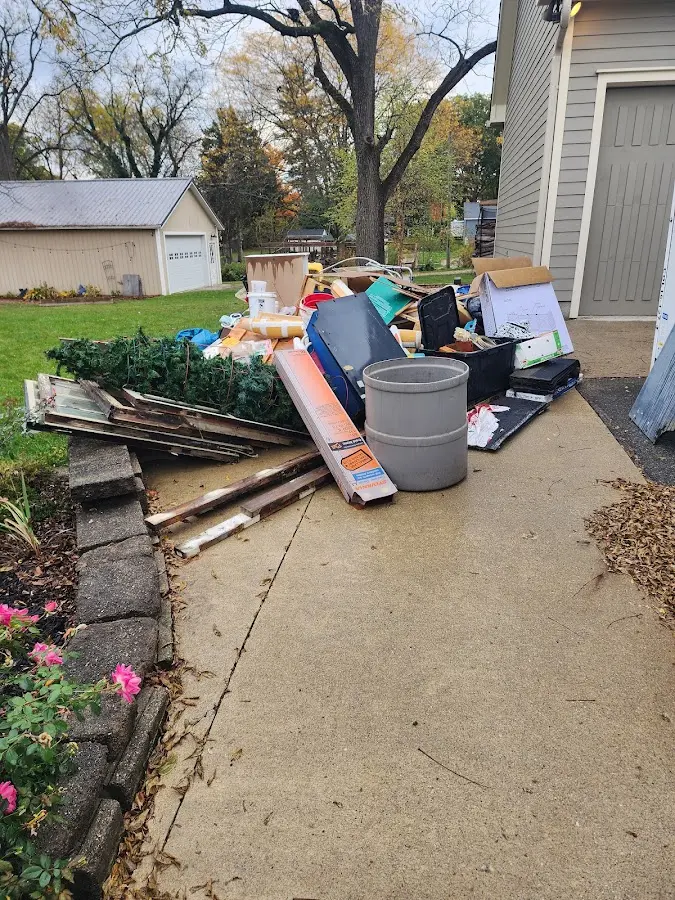 Dumpster being loaded with debris for 30 Yard Dumpster Rental in Boston